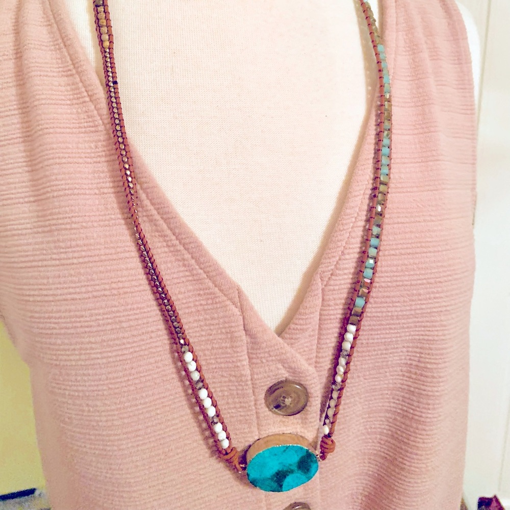 NWOT. Leather and beaded necklace with turquoise pendant. Excellent condition.